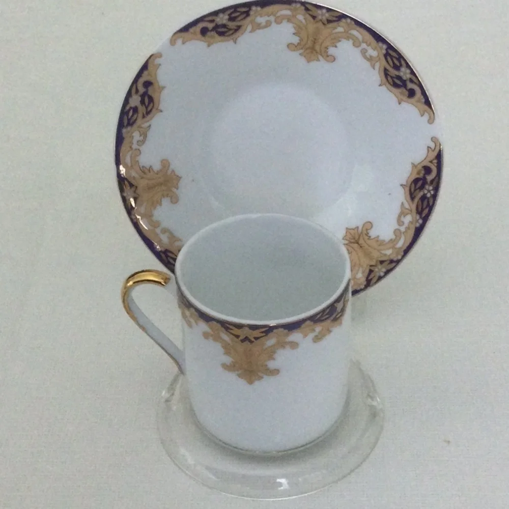 Demitasse Cup and Saucer made in China very pretty design gold white & blue